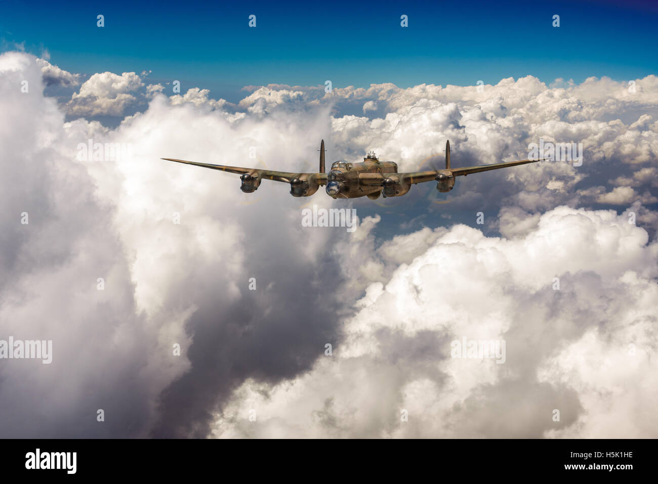 A depiction of a solitary RAF Avro Lancaster bomber making its way through sunlit clouds in July 1944. Stock Photo