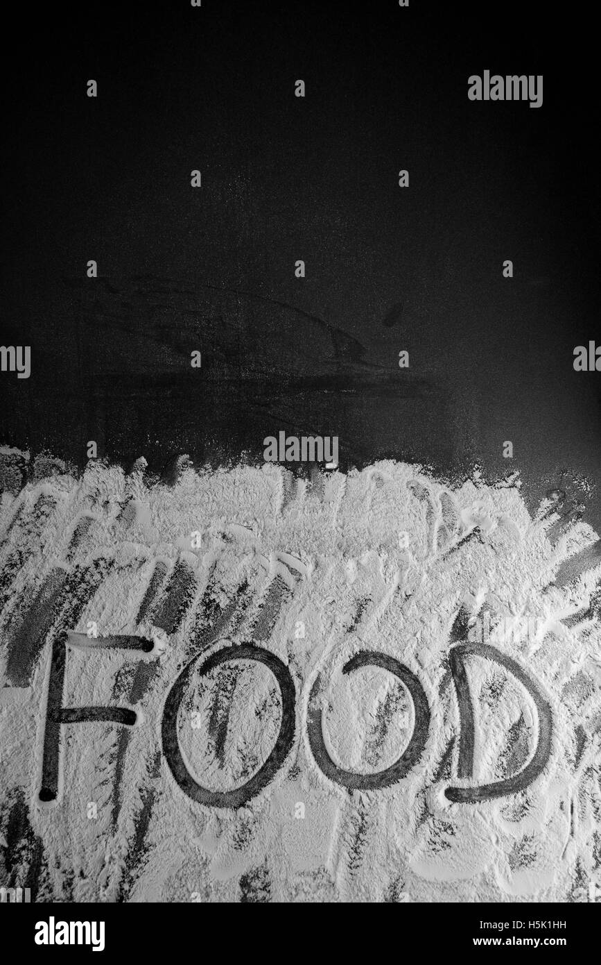 Word food written with flour on black background Stock Photo - Alamy