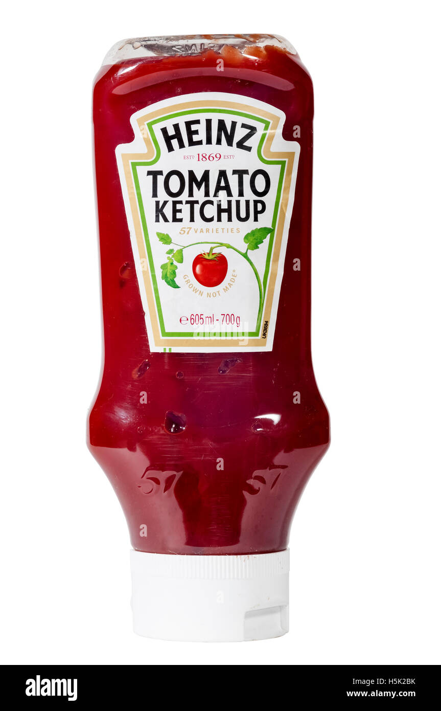A squeezy plastic bottle of Heinz Tomato Ketchup designed to be stood upside down on its lid. Stock Photo