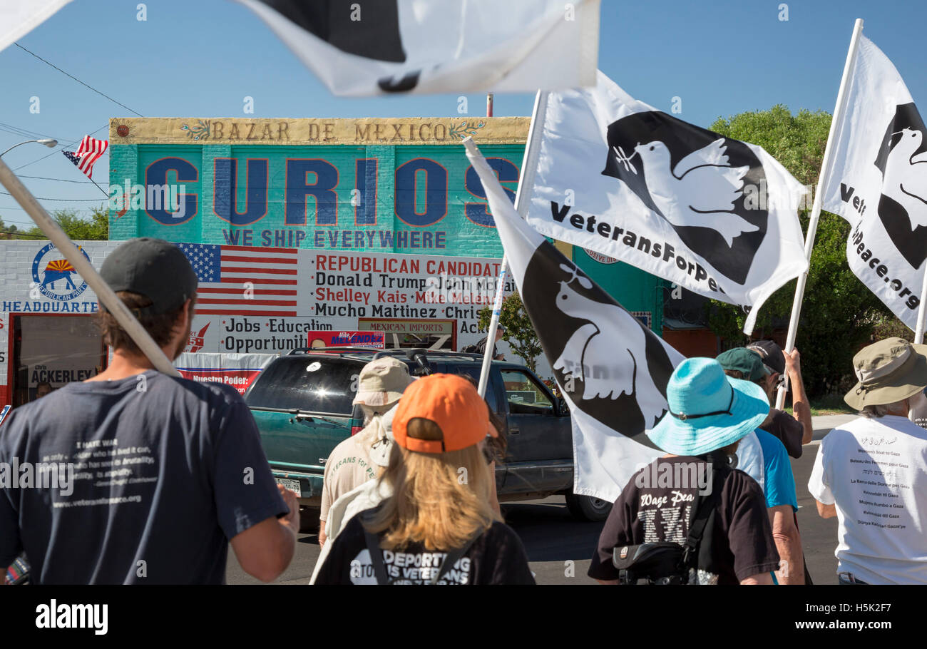 Nogales, Arizona - Activists march past Republican Party headquarters on their way to a rally at the U.S.-Mexico border. Stock Photo