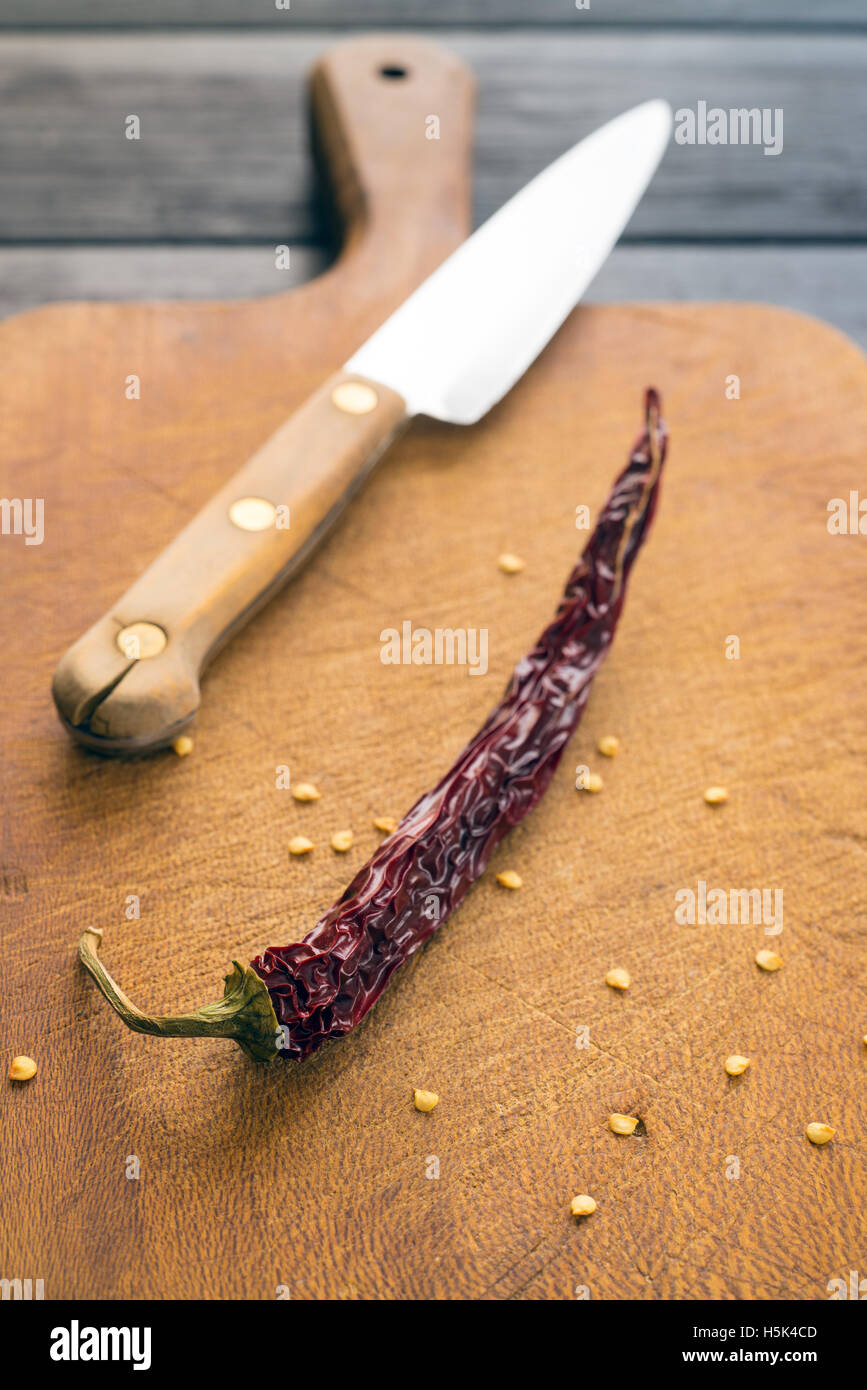 chili pepper on the cutting board Stock Photo - Alamy