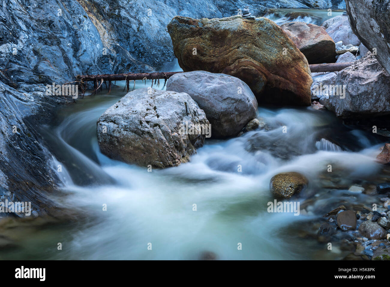 Water flowing around rocks, Garnitzenklamm, Hermagor District, Carinthia, Austria Stock Photo