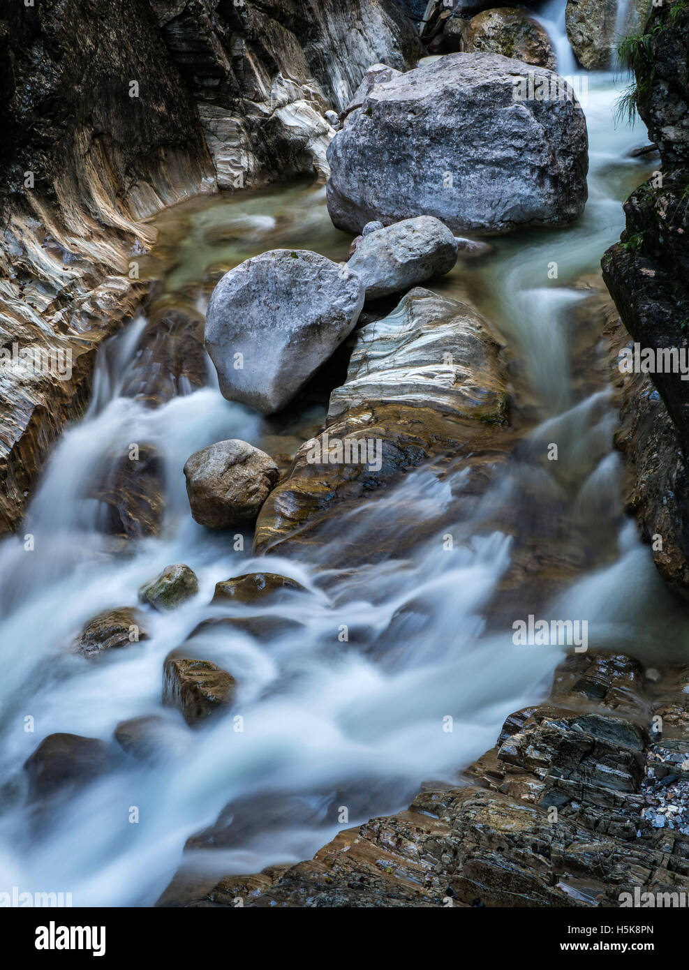 Water flowing around rocks, Garnitzenklamm, Hermagor District, Carinthia, Austria Stock Photo