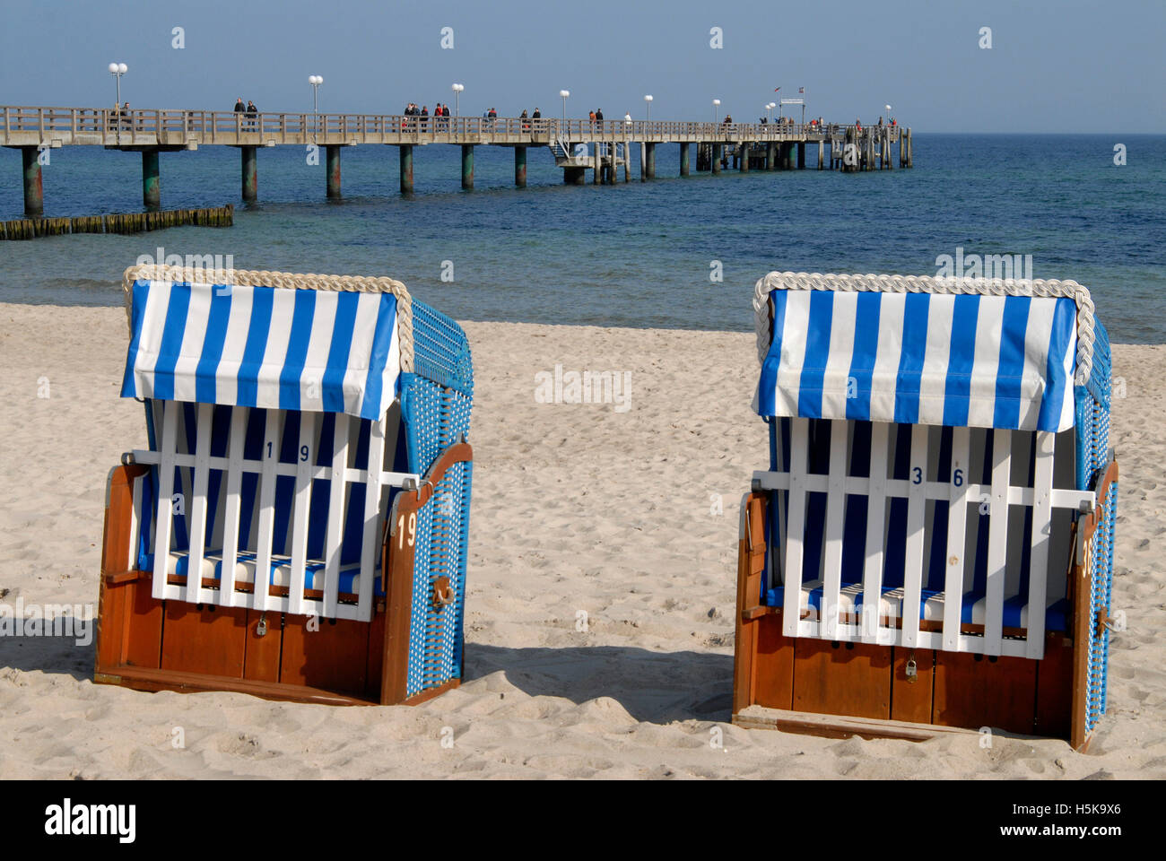 Beach chairs and pier on the beach of Kuehlungsborn on the Baltic Sea ...