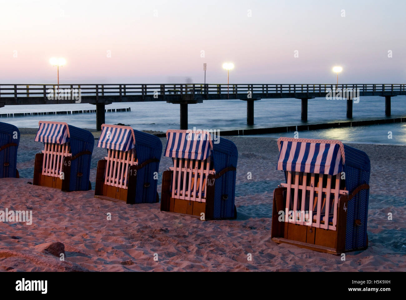 Beach chairs and pier on the beach of Kuehlungsborn on the Baltic Sea ...