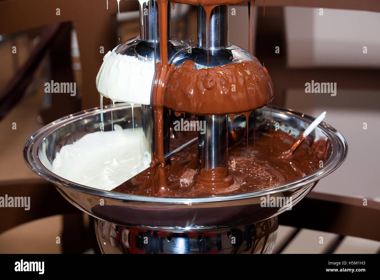 Chocolate fondue fountain Stock Photo