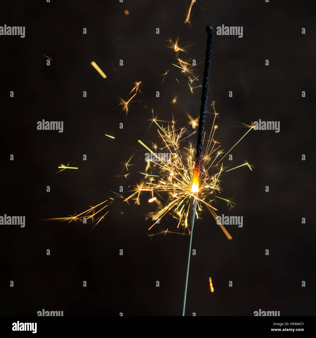 Christmas and newyear party sparkler on dark background Stock Photo