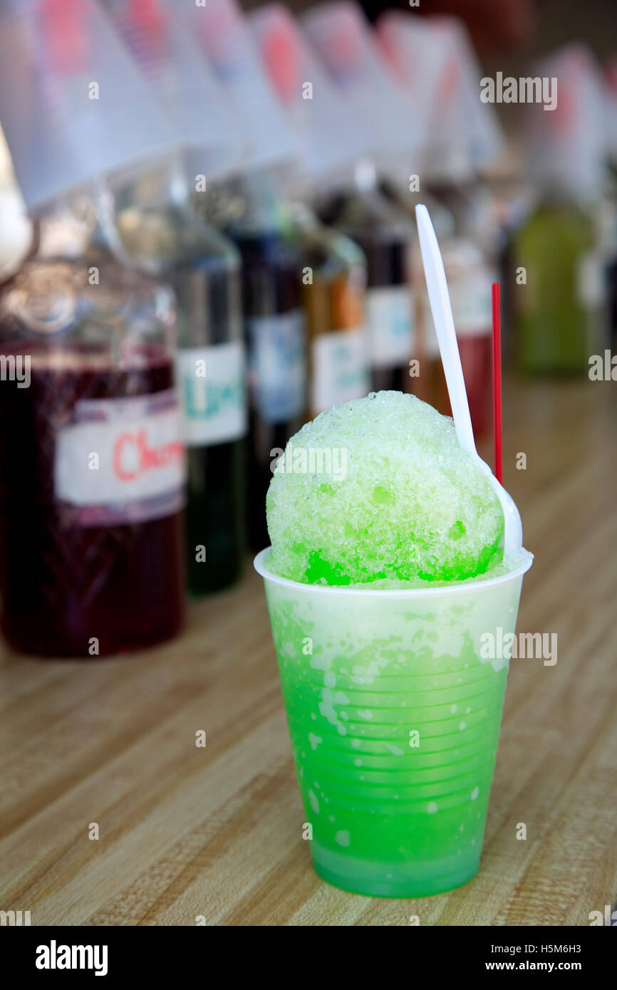 Mexican 'raspado' snow cone and bottles of flavors, Cinco de Mayo Celebration, Old Mesilla, Las Cruces, New Mexico USA Stock Photo