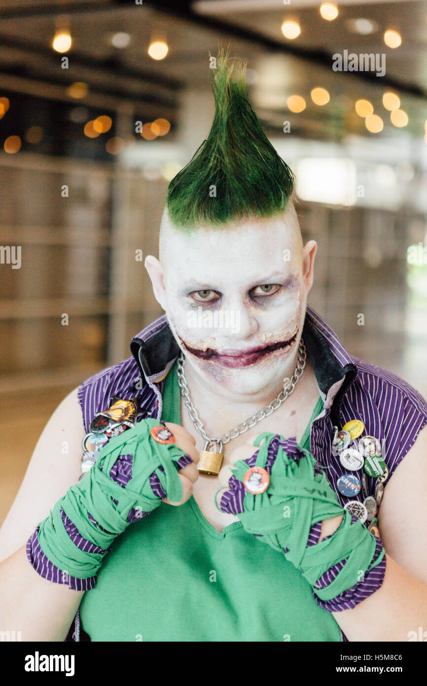 A cosplayer wears a The Joker costume, known from the DC Comics, Batman-universe, at Comic Con Copenhagen 2016. Stock Photo