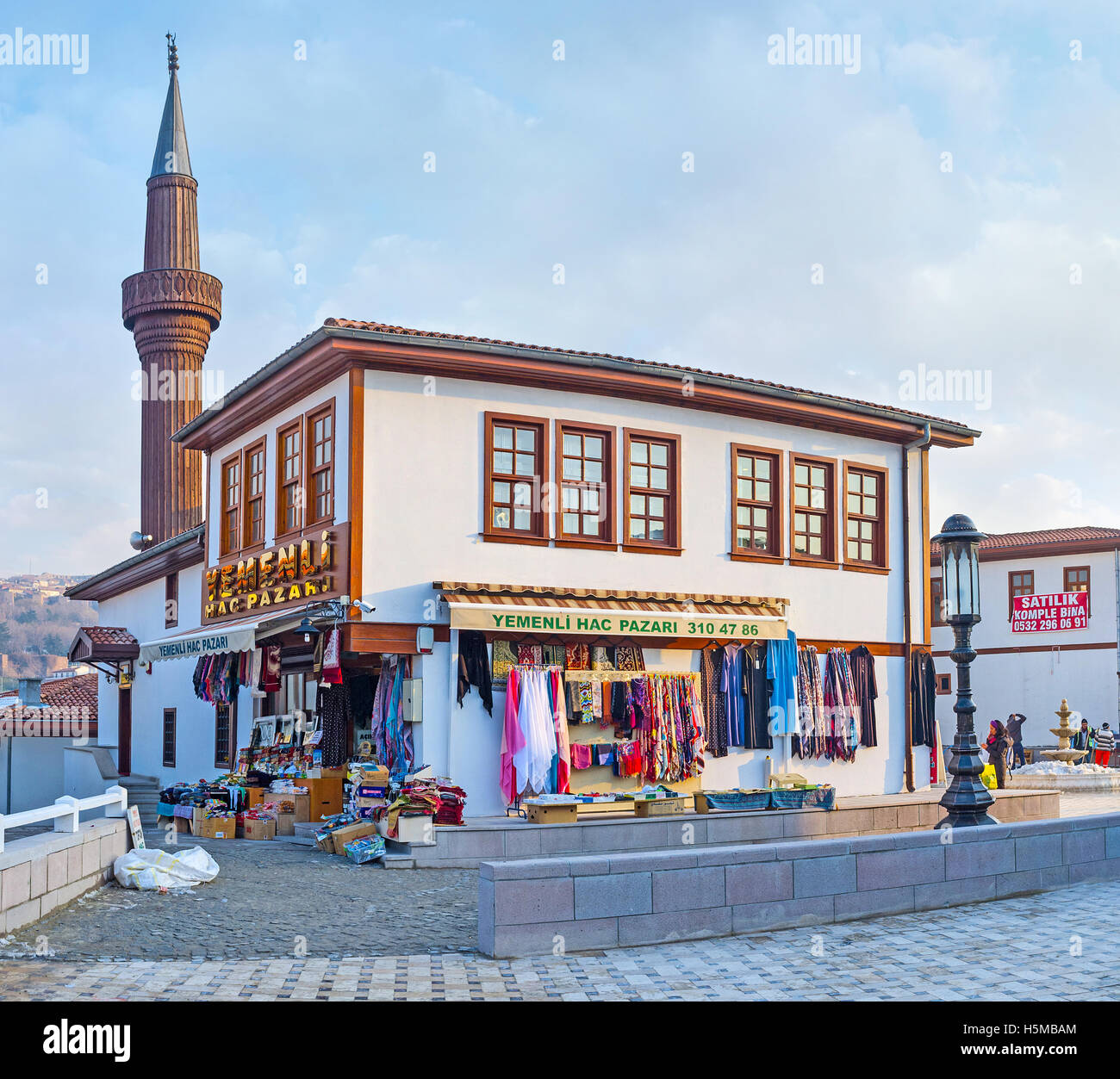 The  scenic cottage of the modern neighborhood in old town with the wooden minaret on the background Stock Photo