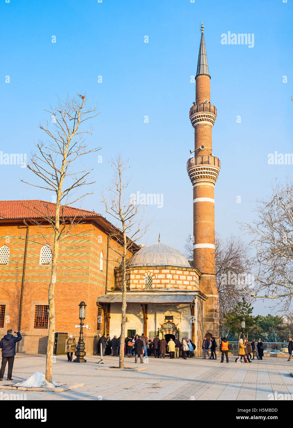 The entrance to the Haci Bayram Mosque with the numerous muslims, coming to pray Stock Photo