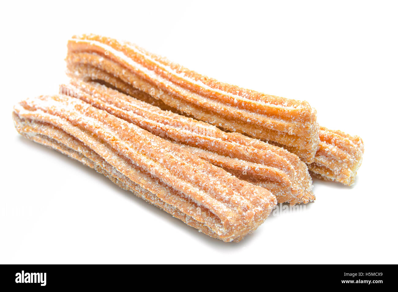 Churros stacked and isolated on white background Stock Photo