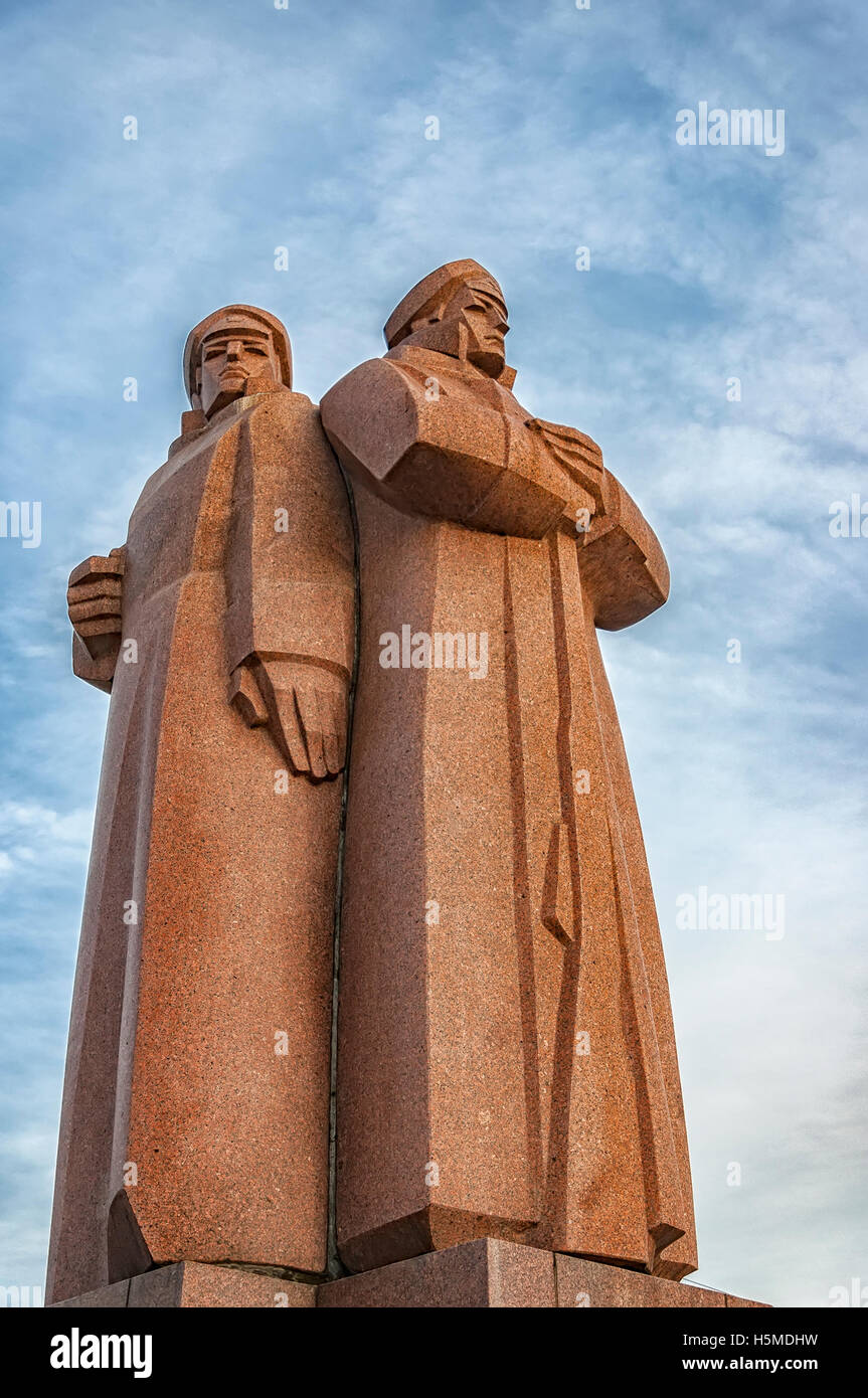 The red riflemen of Riga monument that commemorates Lenin's private Latvian bodyguards. Stock Photo