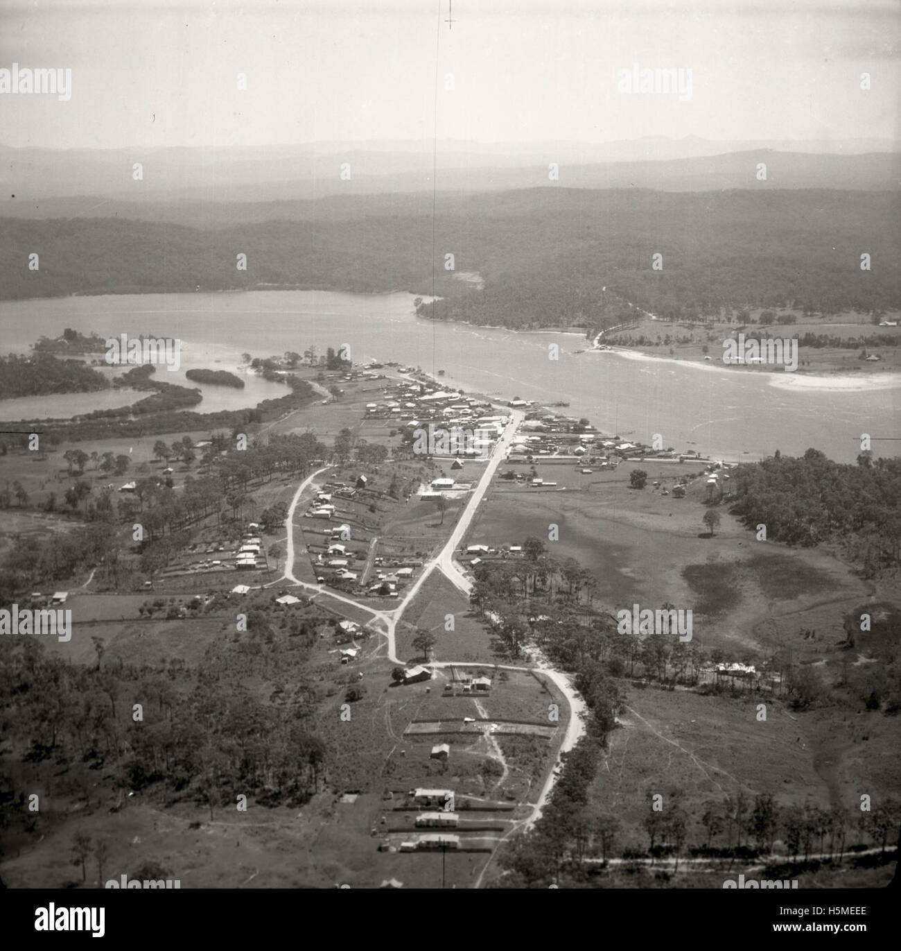 An aerial view of Batemans Bay taken on November 17, 1937, as part of the Adastra Aerial Survey Collection. The image captures the landscape and features of Batemans Bay from a historical perspective. Stock Photo