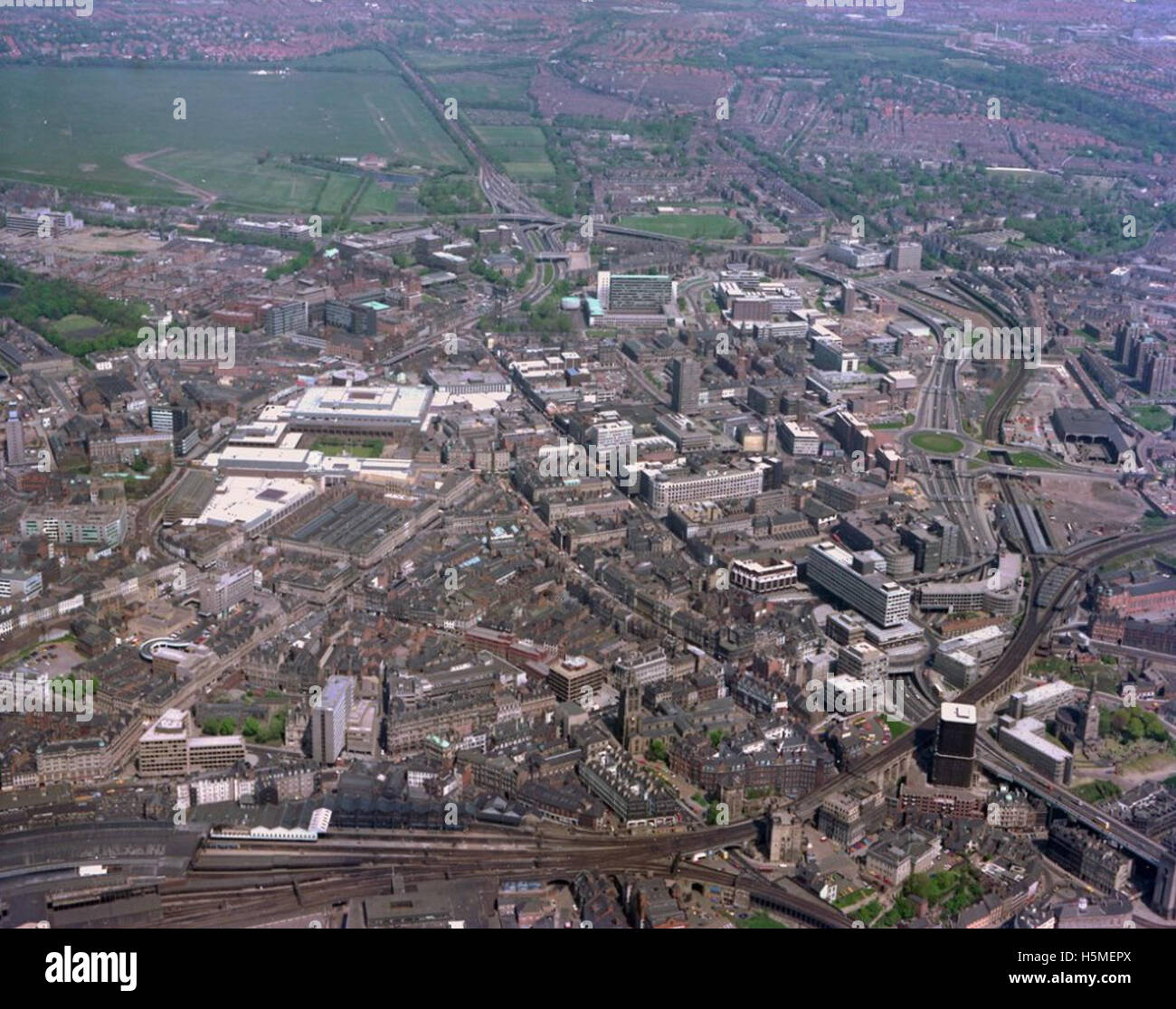 Aerial view of Newcastle City Centre, including notable landmarks such as the Bigg Market, Castle Keep, Central Motorway, Central Station, and St Nicholas Cathedral. The photograph highlights the city's architecture and urban landscape in the heart of North East England. Stock Photo