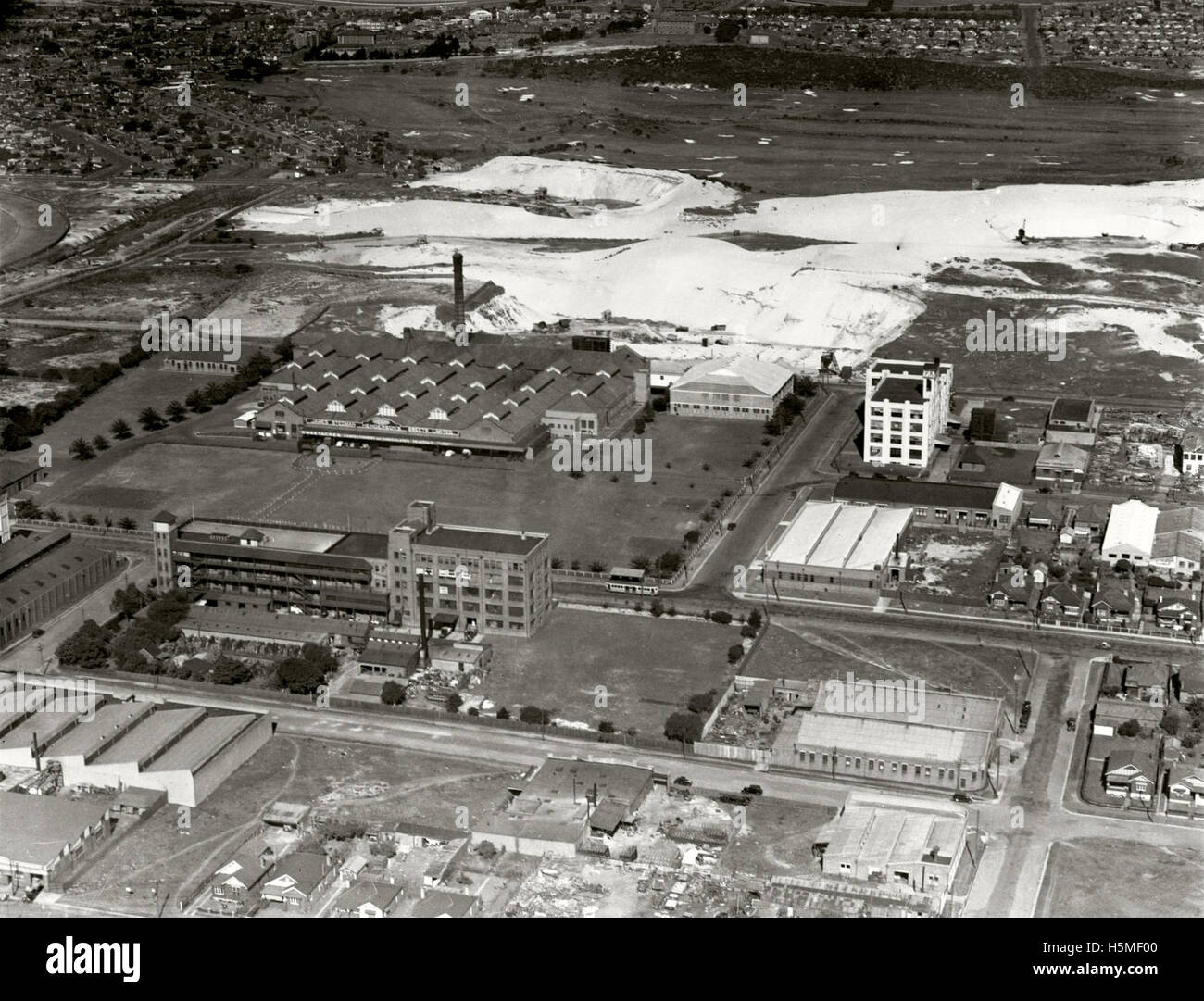 Aerial photograph from the Adastra Aerial Survey Collection, taken in 1938, showing James Stedman Henderson's Sweets Ltd in Rosebery, Sydney, highlighting the industrial landscape of the area during that period. Stock Photo