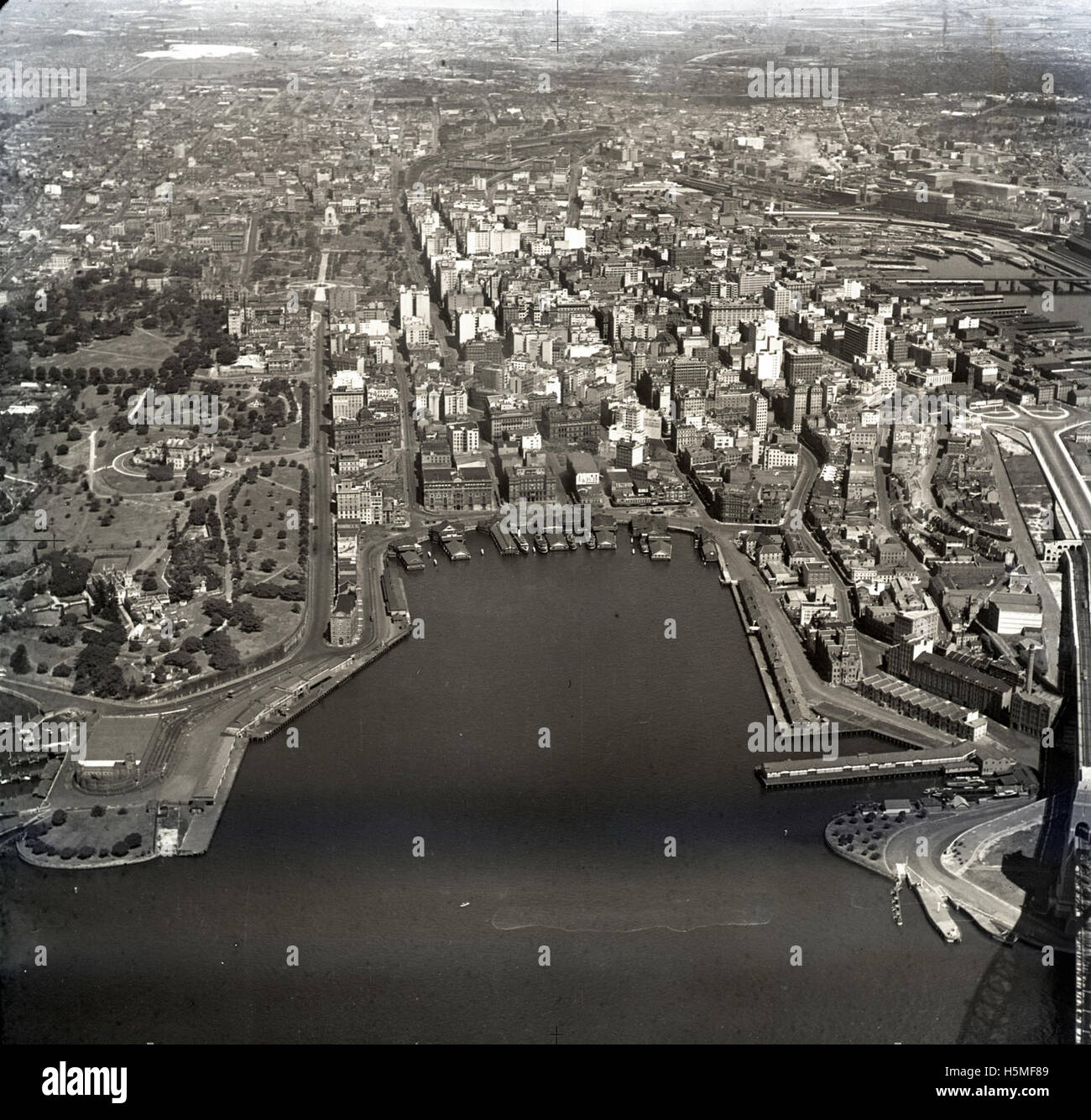 Aerial photograph of Circular Quay, Sydney, taken on 29th September 1935. The image is part of the Adastra Aerial Survey Collection and shows the harbor and surrounding buildings, providing a unique perspective of Sydney’s landscape during the 1930s. Stock Photo