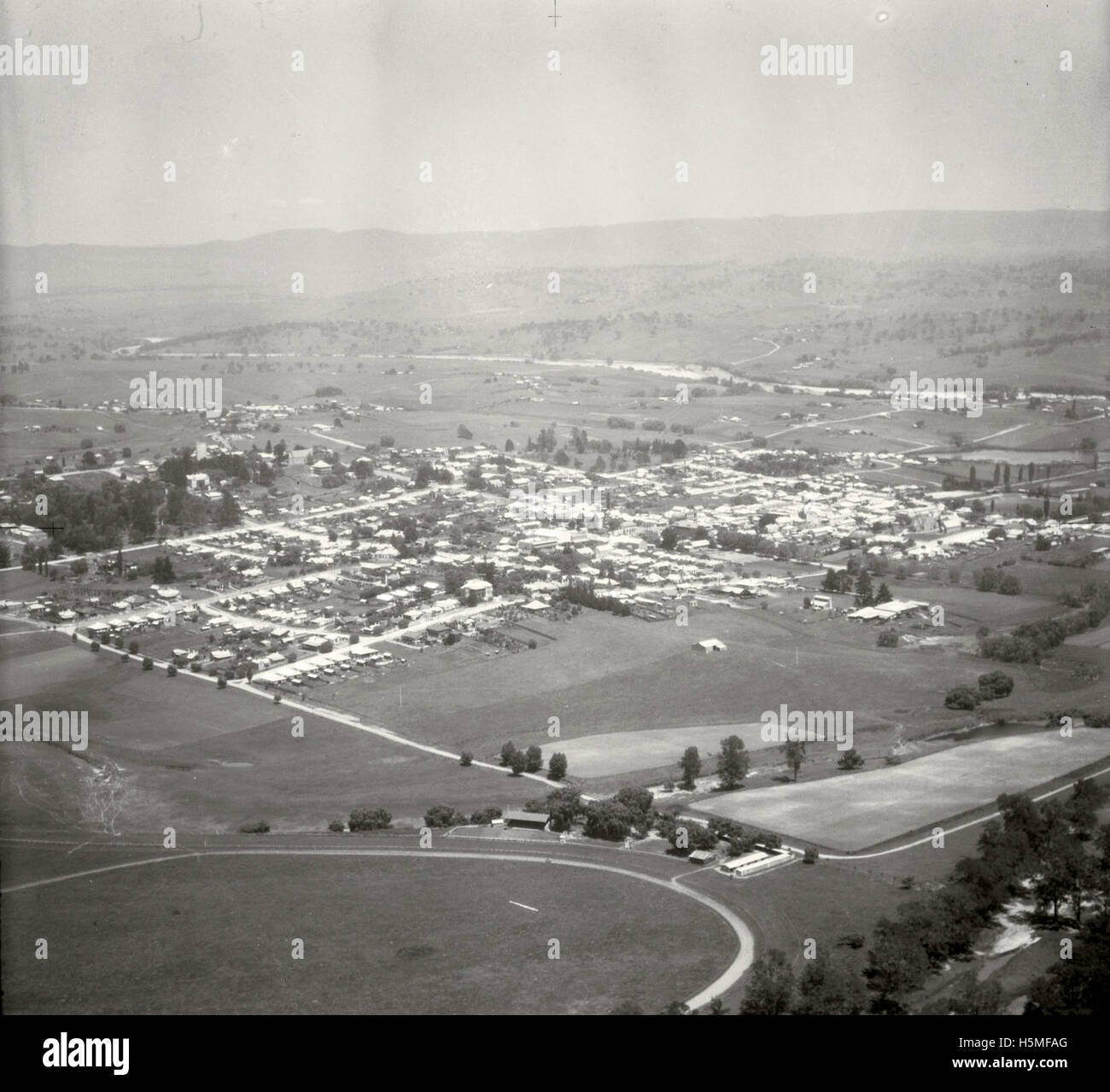 An aerial photograph taken on November 17, 1937, as part of the Adastra Aerial Survey Collection, captures the landscape of Bega, a region in New South Wales, Australia. The image offers a historical perspective of the area during that time. Stock Photo