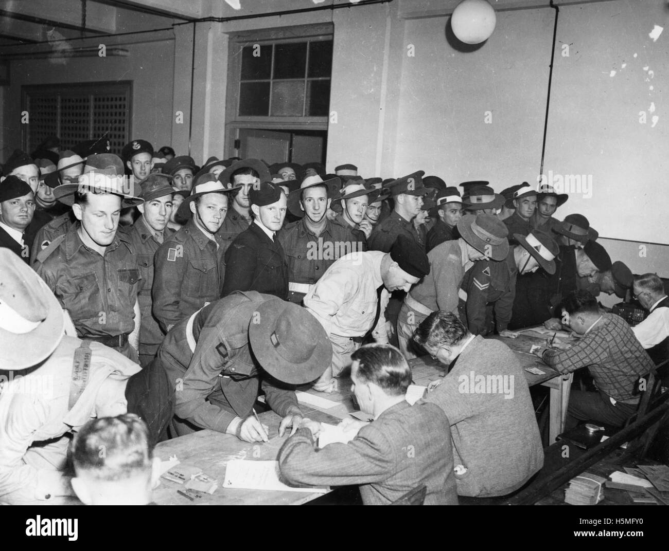 This title refers to servicemen awaiting their turn to vote in the 14 Powers Referendum, a historical event that involved military personnel and their voting participation. Stock Photo