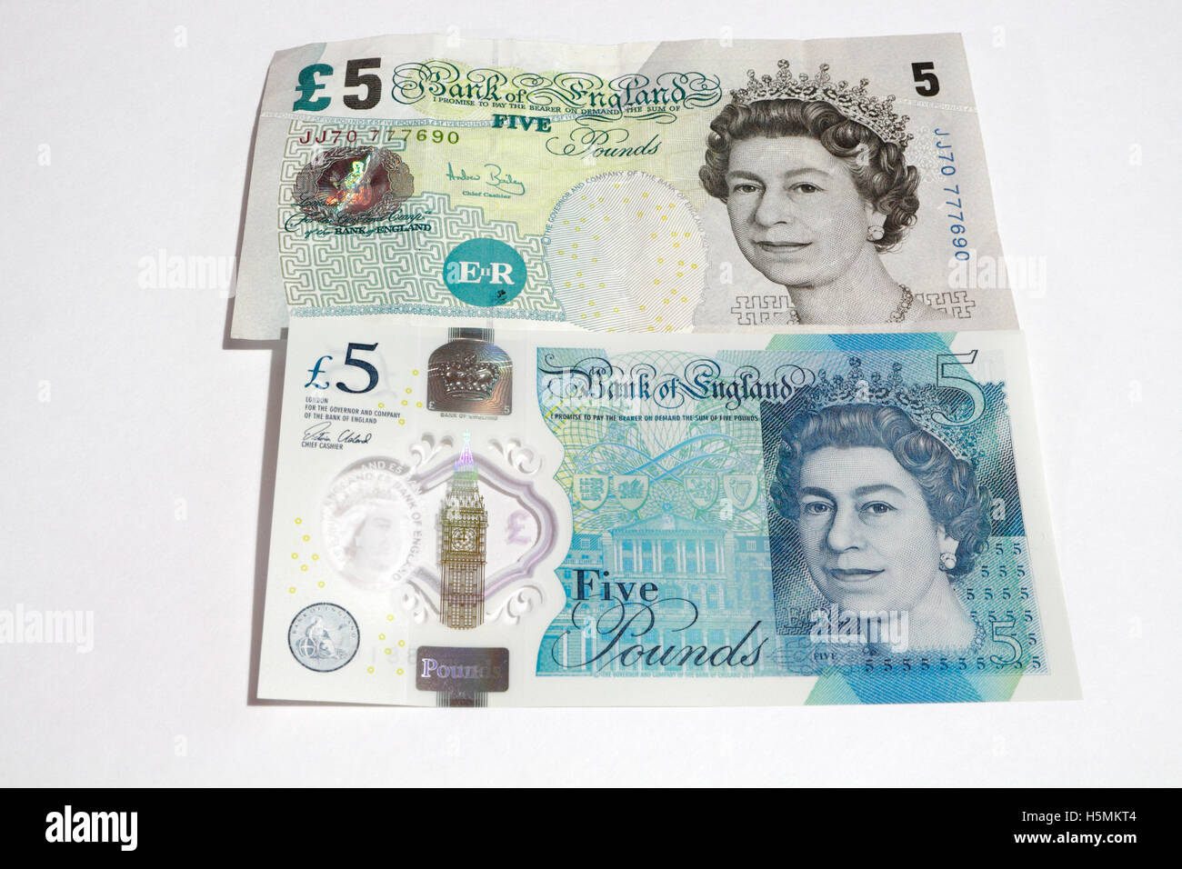 Comparison new and old £5 Five pound notes Stock Photo