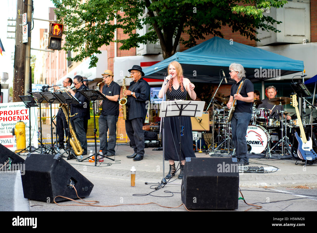 TORONTO, CANADA - AUGUST 22, 2015; Street perfomer during Toronto Jazz festival on Queen street east. Stock Photo
