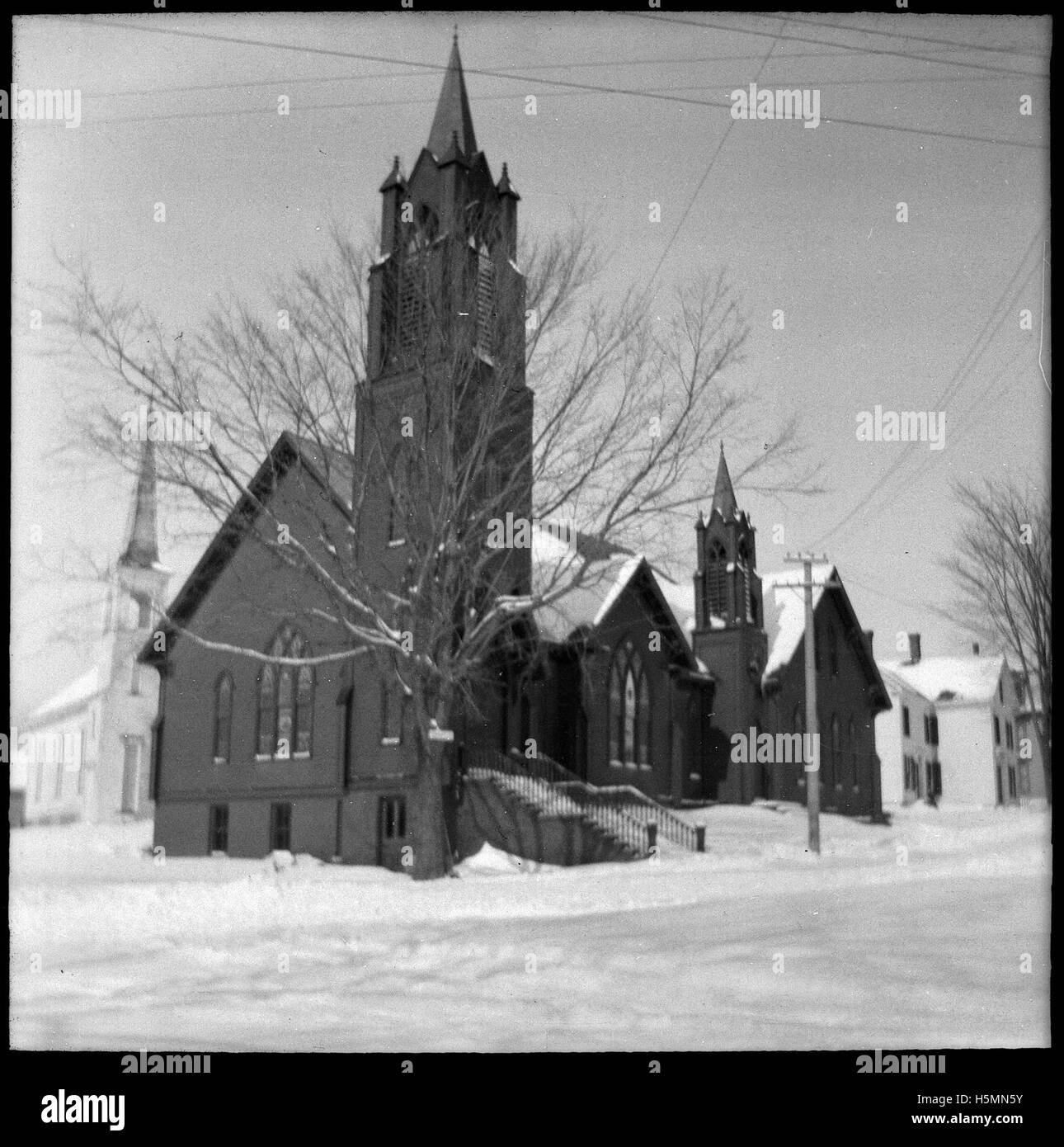 The Methodist Church at the corner of Mountain and Main Street.  The Universalist Church is visible behind it on Central Street. Stock Photo