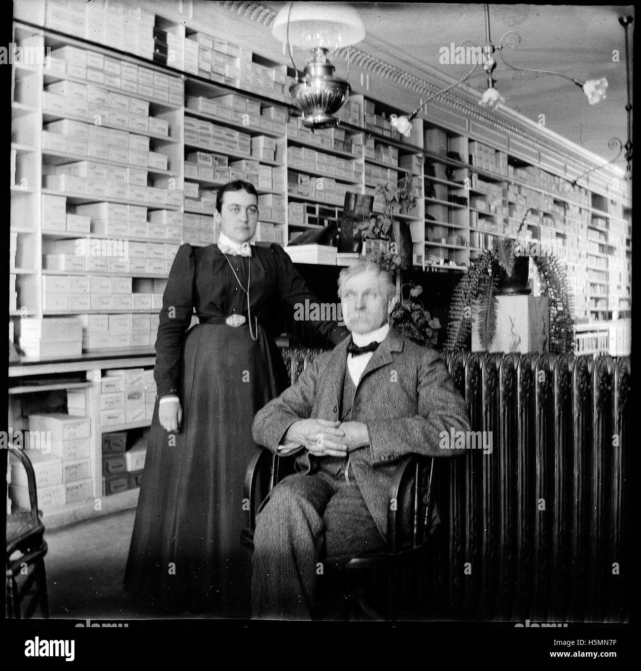 Photo of 2 people in George Burd's shoe store on Main Street in Camden
