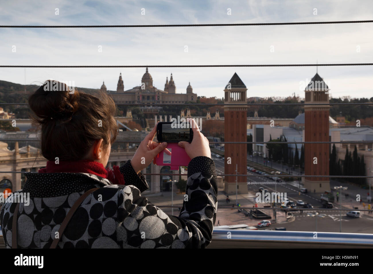 Woman taking a photo with a mobile phone in Plaza Espana, Barcelona Stock Photo