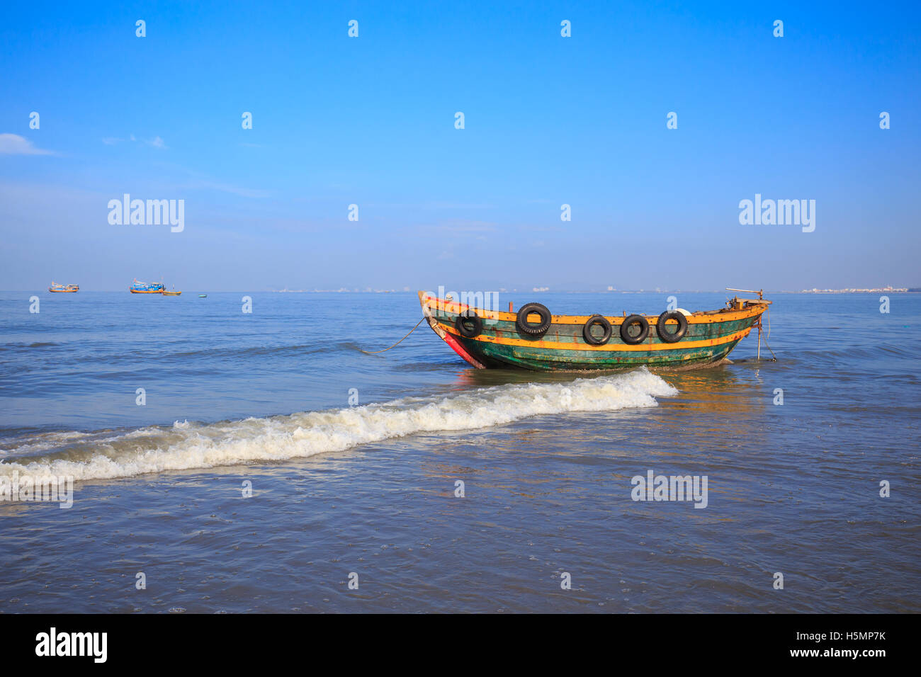 Fishing boat under blue sky at Long Hai beach, Ba Ria, Vung Tau, VietNam Stock Photo
