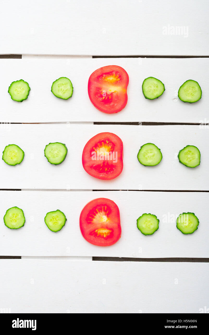 slices of cucumber and red tomatoes Stock Photo - Alamy