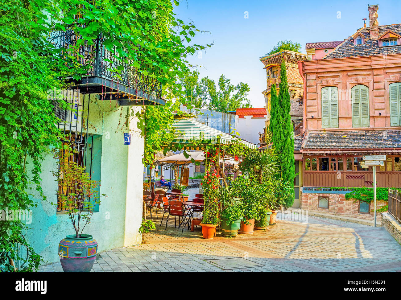 The summer terraces of Shavteli street cafes, decorated with numerous plants in pots, Tbilisi Georgia Stock Photo