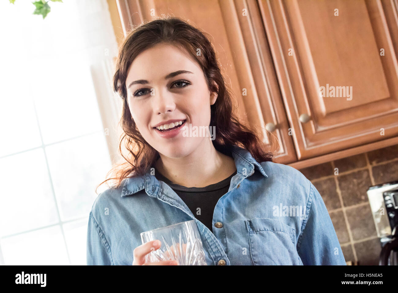 Young adult drinking water Stock Photo Alamy