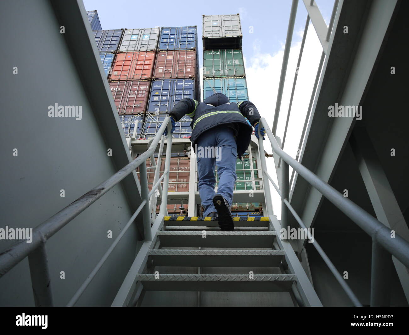 A sailor check the cargo of a container ship Stock Photo
