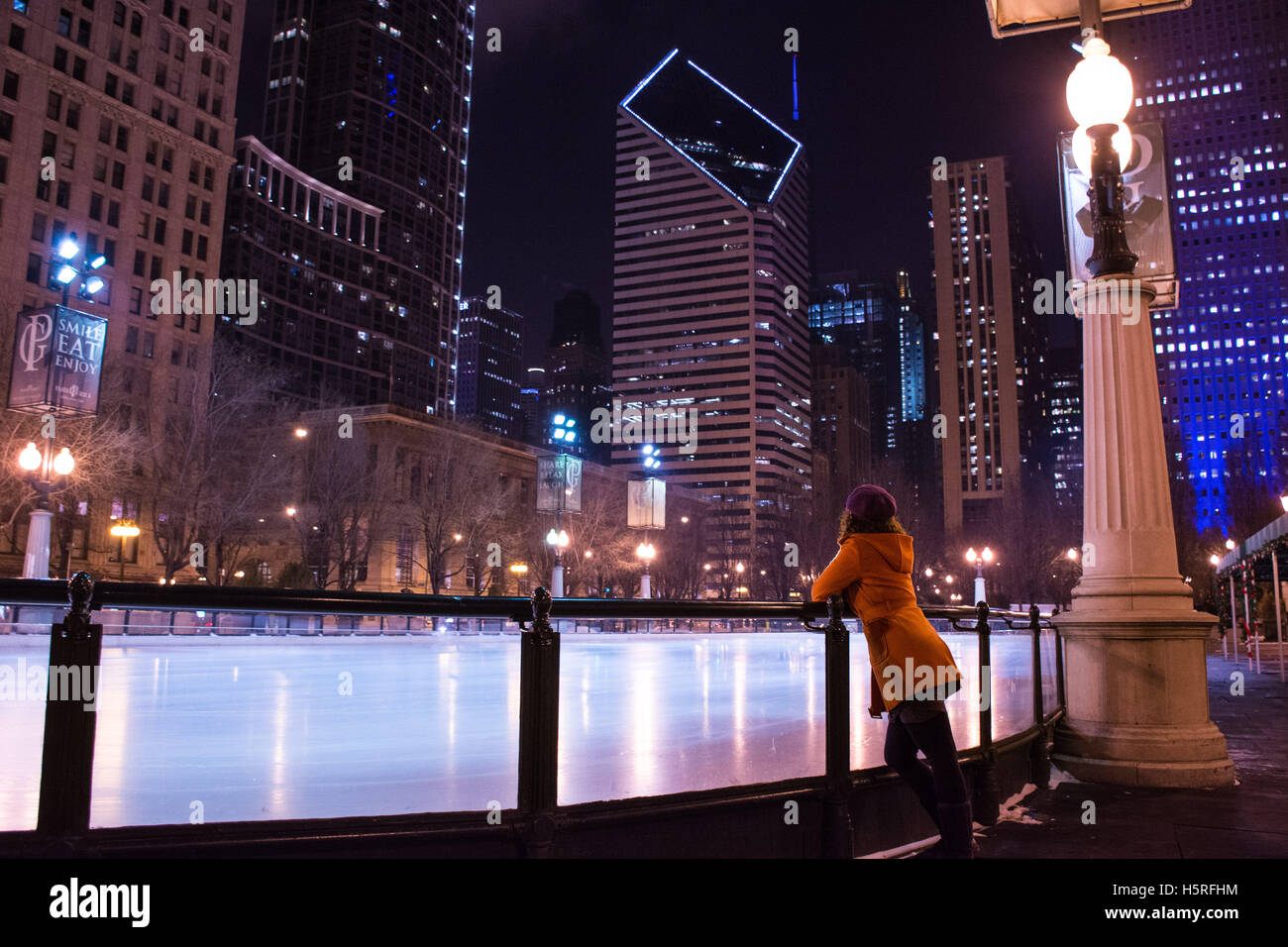 Girl looking at downtown Chicago over ice rink Stock Photo Alamy