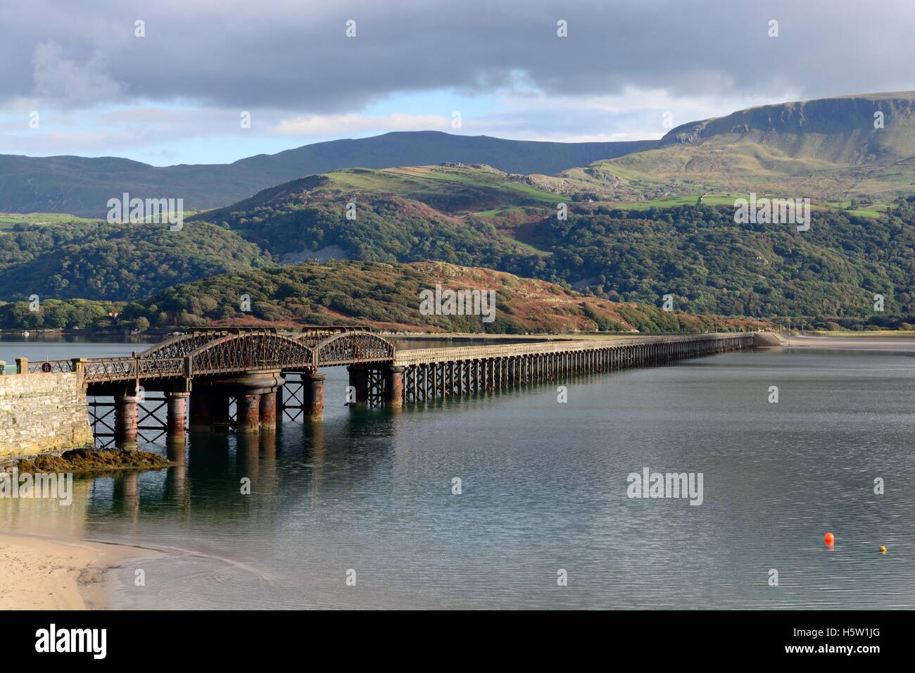 Barmouth Bridge crossing Afon River Mawddach Estuary Gwynedd Wales