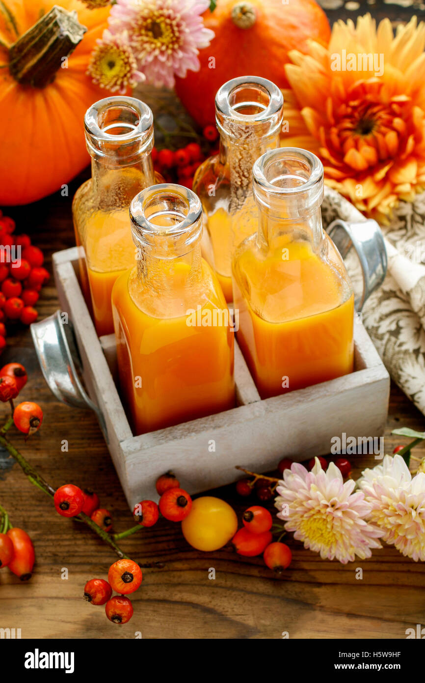 Bottles with orange juice. Party drink Stock Photo Alamy
