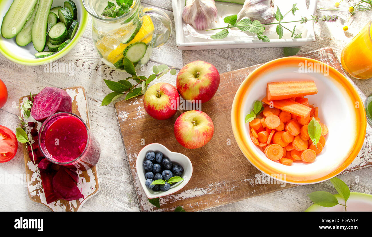 Different fruits, juice and vegetables. Healthy diet eating. View from above Stock Photo