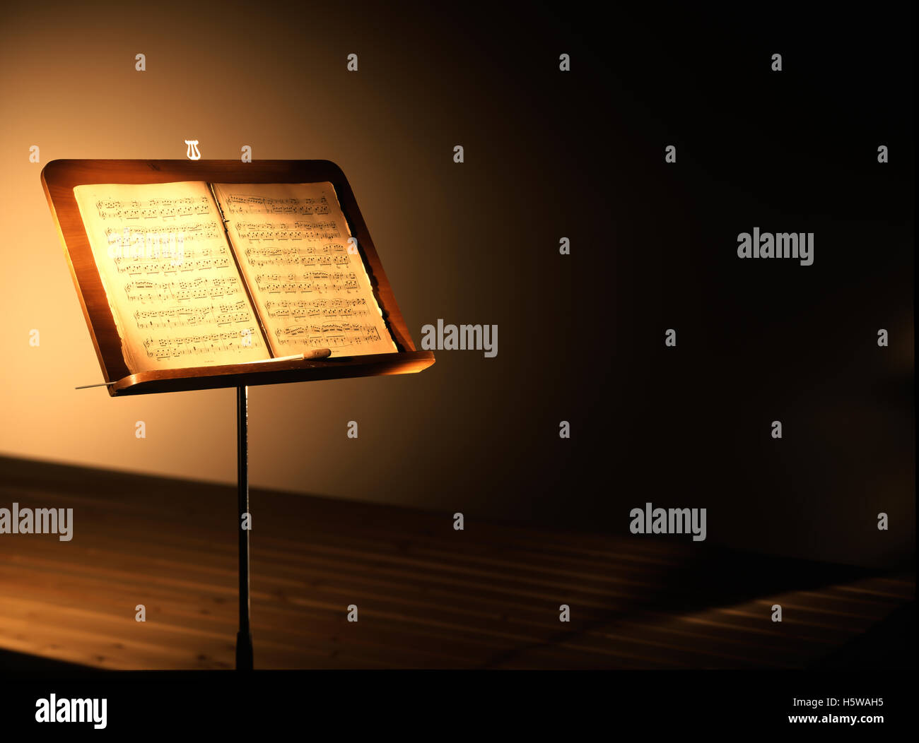 antique music stand with tablature book Stock Photo