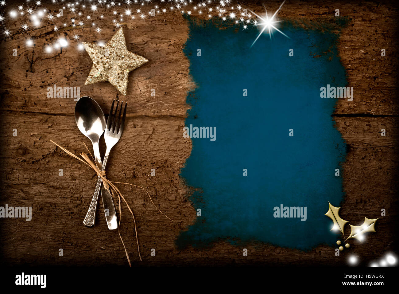 Background for writing the Christmas menu, parchment on old wooden table and Christmas decorations Stock Photo