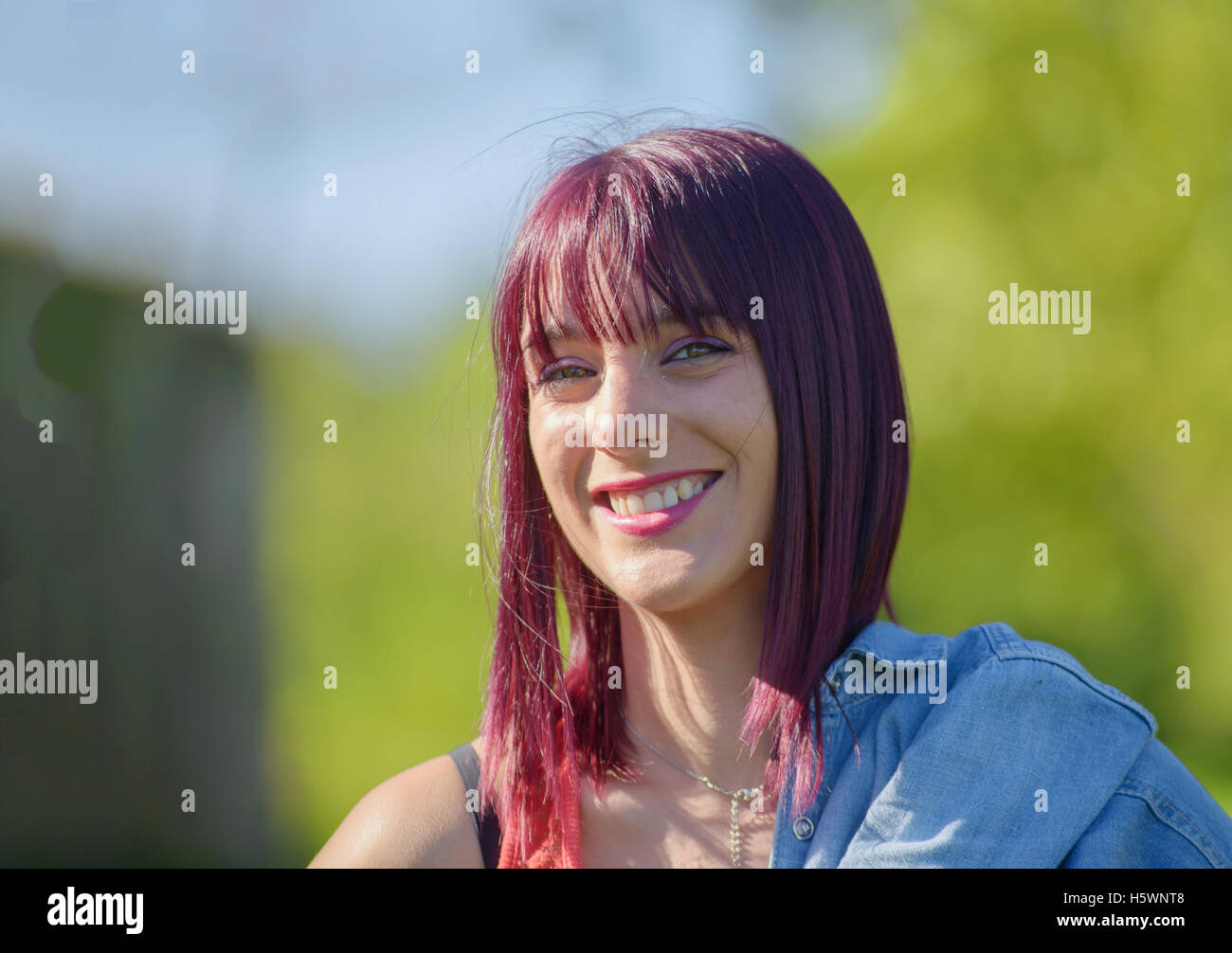portrait of beautiful young woman with red hair, outdoors Stock Photo ...