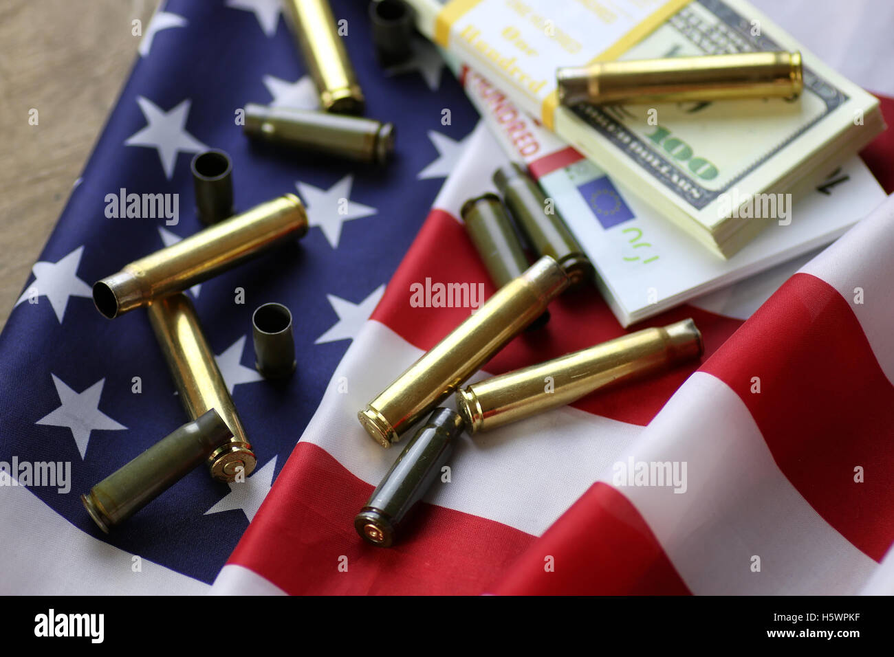 Bullet And Money On The American Flag Stock Photo Alamy