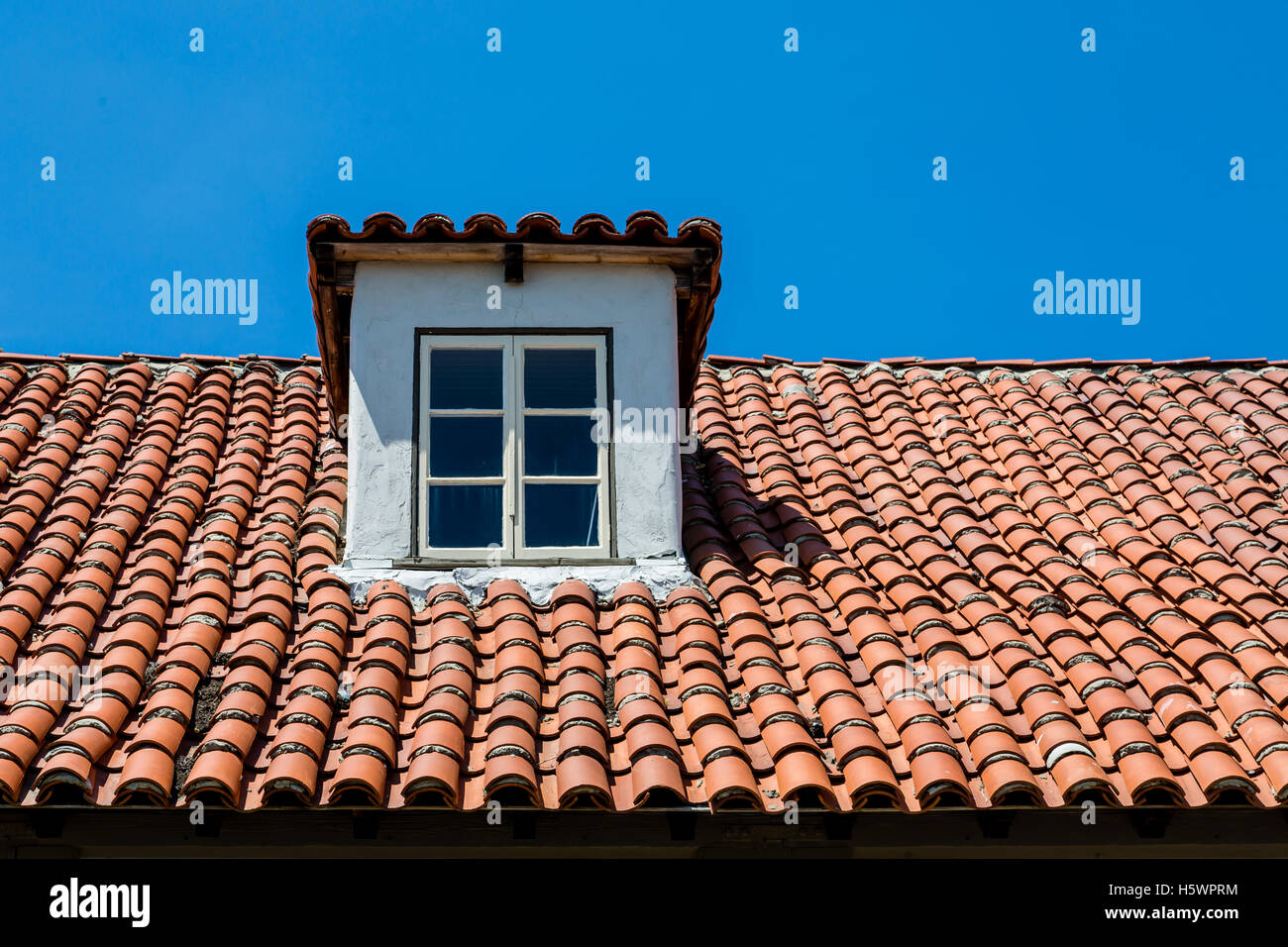 A red clay tile roof on a plaster hacienda Stock Photo Alamy