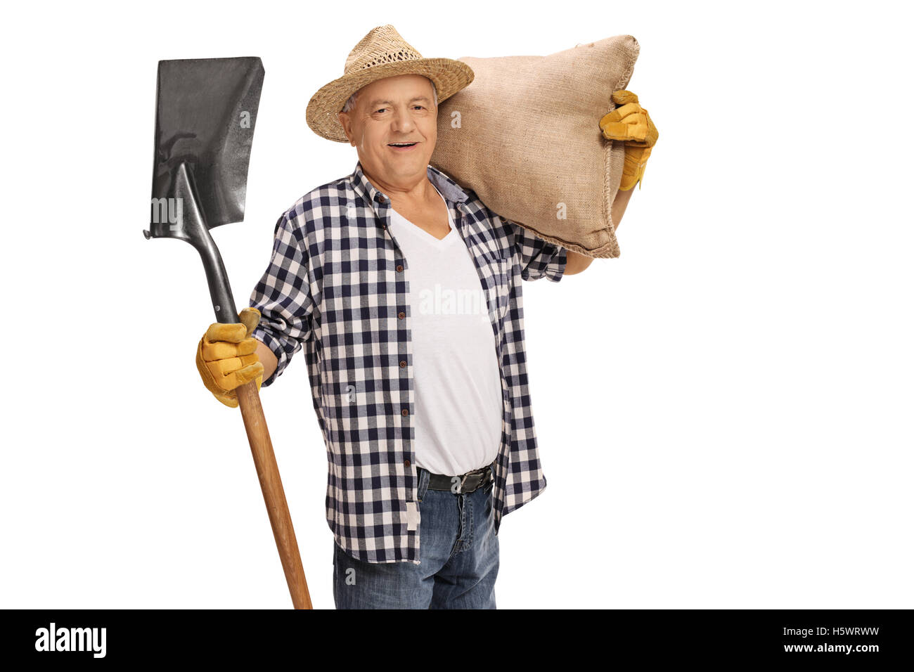 Joyful elderly farmer posing with a shovel and a burlap sack isolated ...