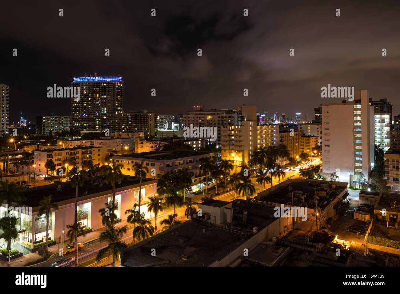 Long exposition night shot of Miami Beach, Florida, with Downtown Miami skyscrapers in the distance. Stock Photo