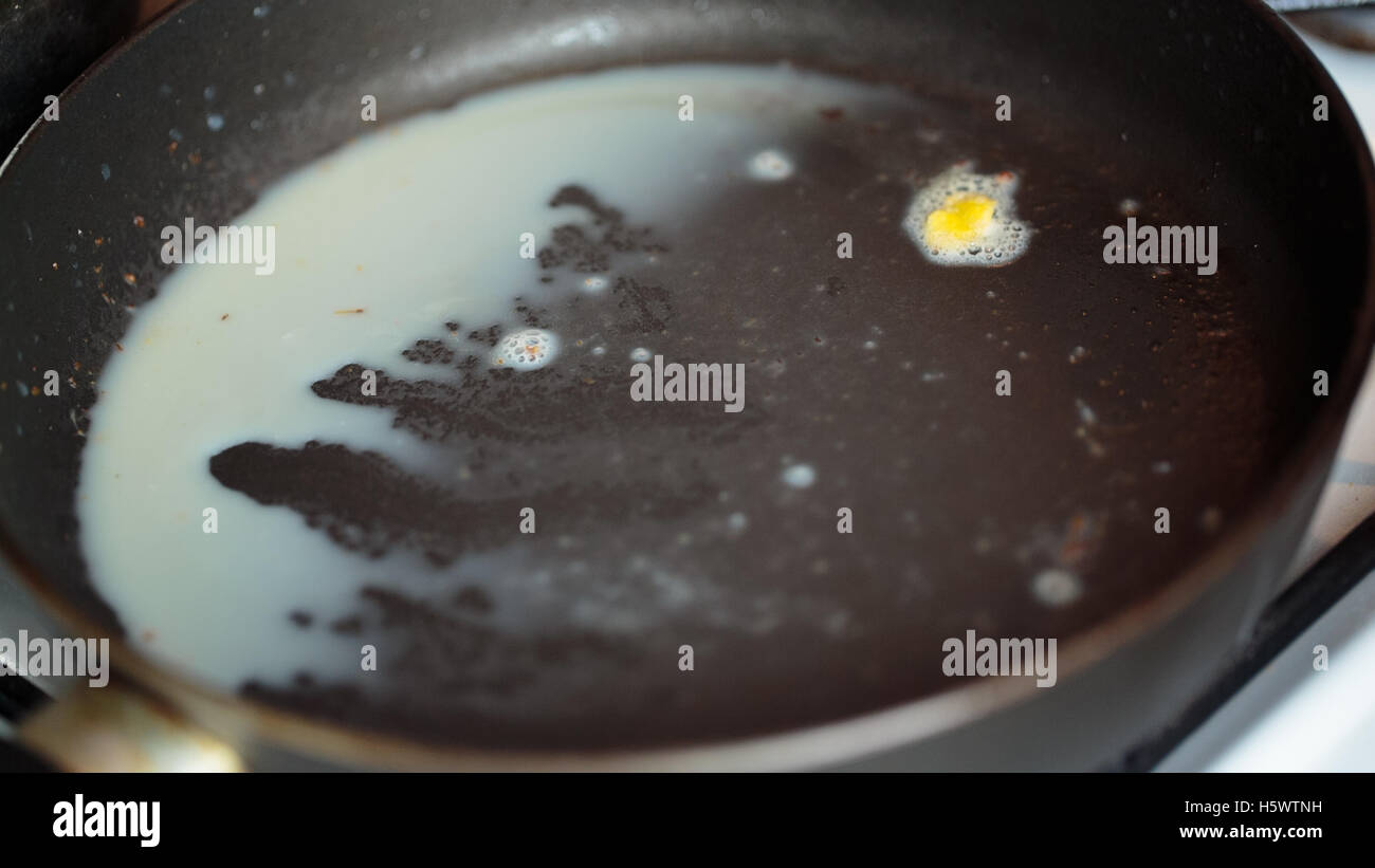 Frying pan with oil Stock Photo Alamy