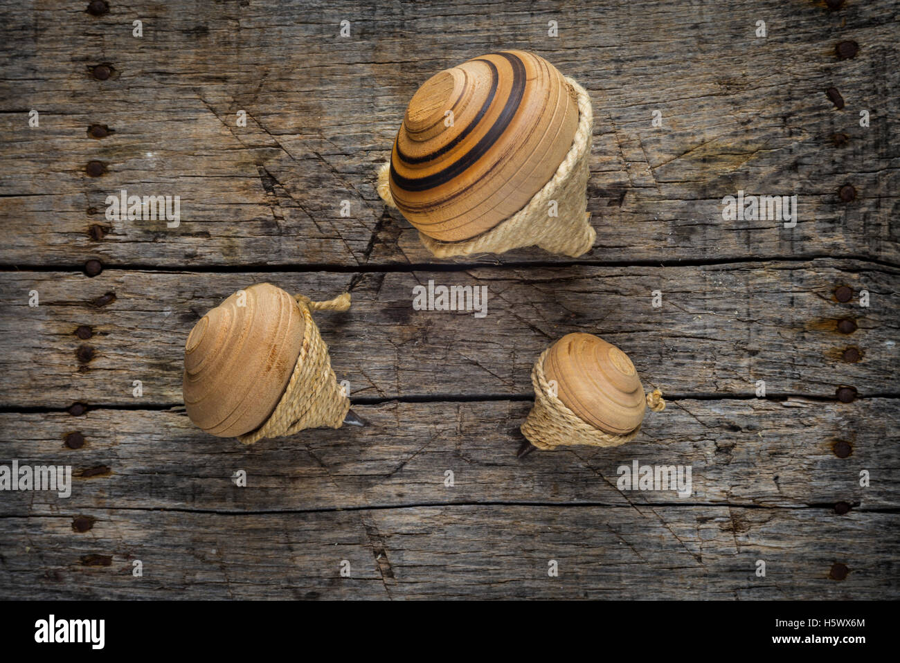 Old vintage spinning tops with small rope Stock Photo Alamy