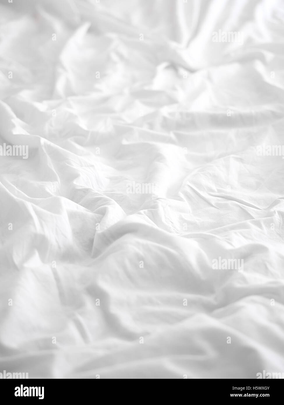 Soft white bed sheet background Stock Photo - Alamy