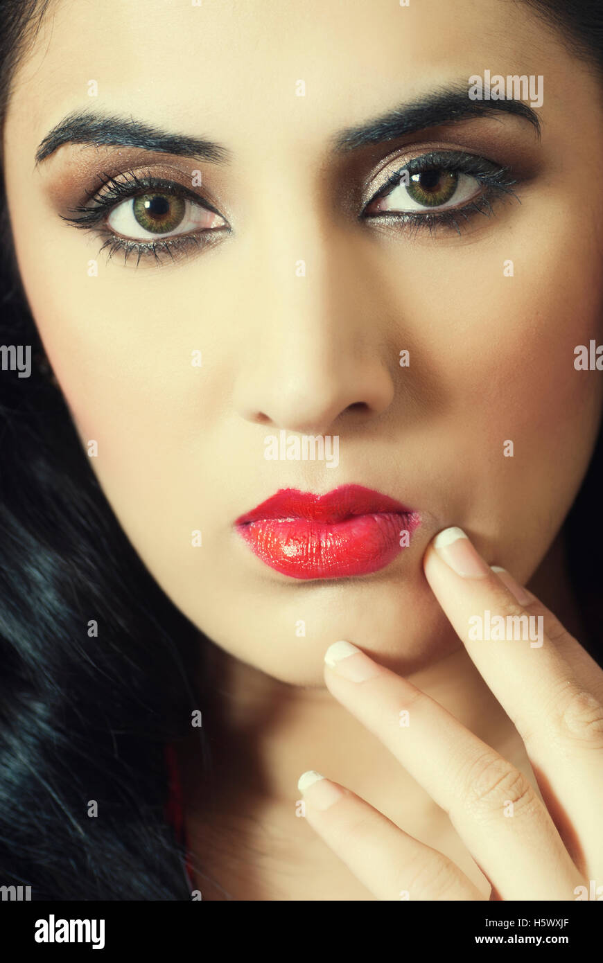 Beautiful young woman hand touching face Stock Photo - Alamy