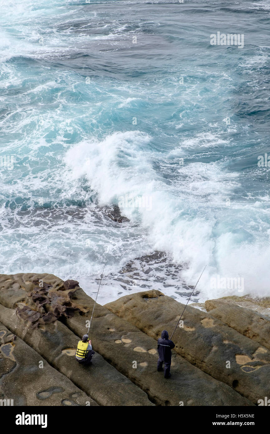 Two men fishing off rocks near Sydney Heads, Australia Stock Photo Alamy
