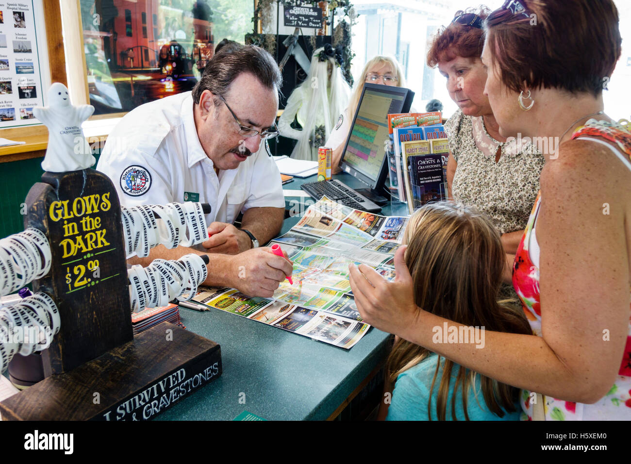 St. Saint Augustine Florida,Visitor Information Center,centre,desk,help,helping,adult,adults,man men male,working work worker workers,employee staff,g Stock Photo